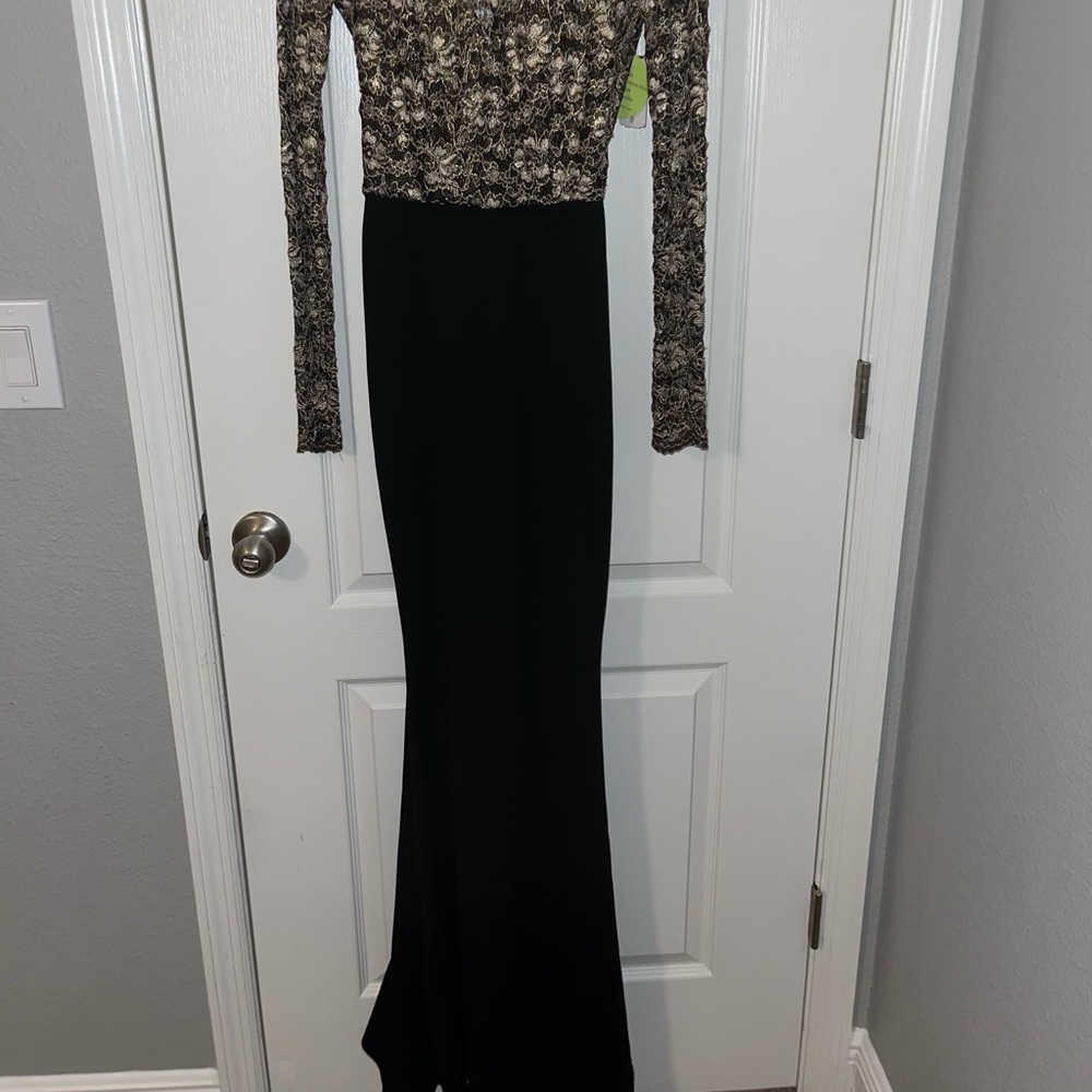 Elegant black and gold dress with train